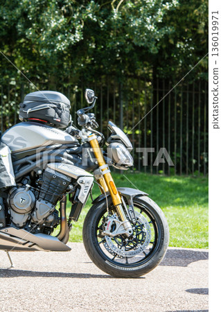 A group of large motorbikes on the Long Walk leading from Windsor Castle on the outskirts of London A group of large motorbikes on the Long Walk leading from Windsor Castle on the outskirts of London 136019971