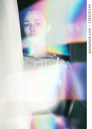 Woman portrait enveloped in dreamlike rainbow spectrum light Woman portrait enveloped in dreamlike rainbow spectrum light 136020144