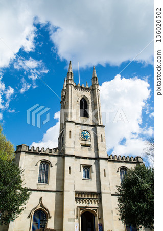 A historic stone church under bright sunlight in Windsor, a suburb of London 136020502