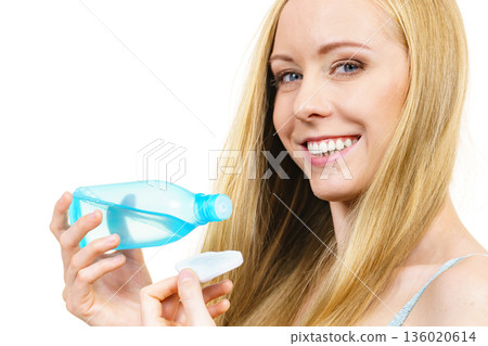 Woman using cleanser cosmetic 136020614