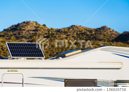 Caravan with tilt solar panels on roof. Caravan with tilt solar panels on roof. 136020738