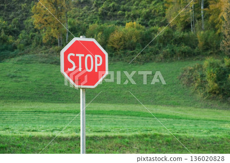 Red and white prohibitory sign with the text Stop, space for text Red and white prohibitory sign with the text Stop, space for text 136020828