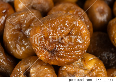 Macro shot of organic sun-dried figs, detailed view. 136020854