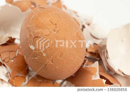 Broken shell texture, macro shot of a hard boiled egg. Broken shell texture, macro shot of a hard boiled egg. 136020858