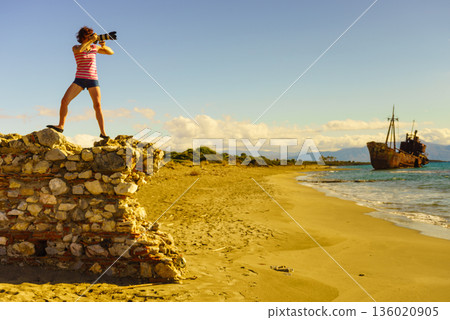 Tourist take photo on beach sea shore Tourist take photo on beach sea shore 136020905