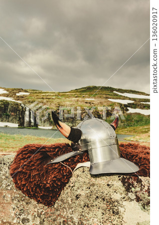Viking helmet on lake shore, Norway 136020917