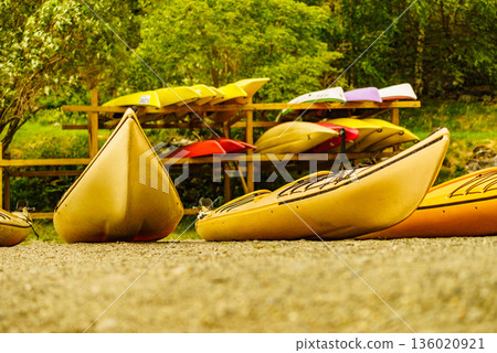 Kayaks on water shore. Rental area 136020921