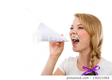 Woman screaming through megaphone made of paper 136021068