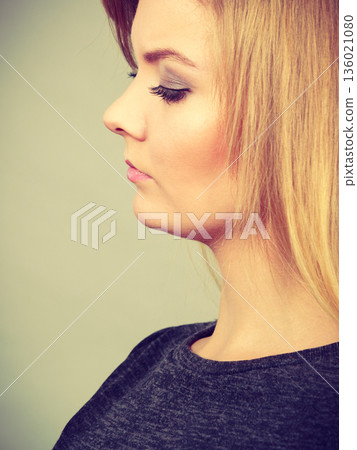 Portrait of feminine blonde young woman 136021080