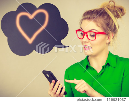 Business woman looking at phone, thinking bubble Business woman looking at phone, thinking bubble 136021087