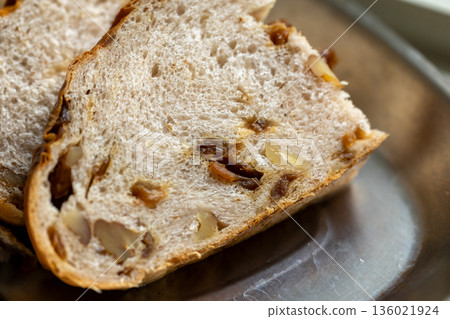 Cross-section of handmade natural yeast longan and walnut bread 136021924