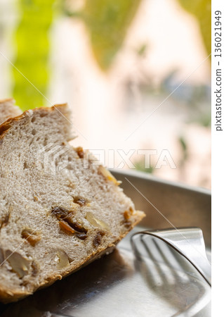 Longan and walnut bread slices by the window in the sunlight Longan and walnut bread slices by the window in the sunlight 136021949