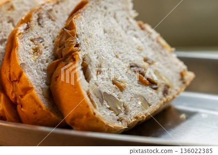 European-style longan and walnut bread slices by the window in the sunlight European-style longan and walnut bread slices by the window in the sunlight 136022385
