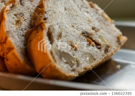 European-style longan and walnut bread slices by the window in the sunlight European-style longan and walnut bread slices by the window in the sunlight 136022395