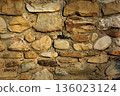 Stone wall background, old masonry wall stone texture 136023124