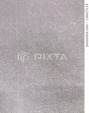 Light gray textured surface inviting touch and exploration in soft hues 136023159