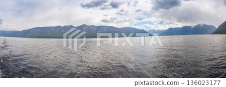 Early morning landscape of Teletskoye lake in Altai Russia. Calm water, soft light and serene mountain atmosphere near Artybash Early morning landscape of Teletskoye lake in Altai Russia. Calm water, soft light and serene mountain atmosphere near Artybash 136023177