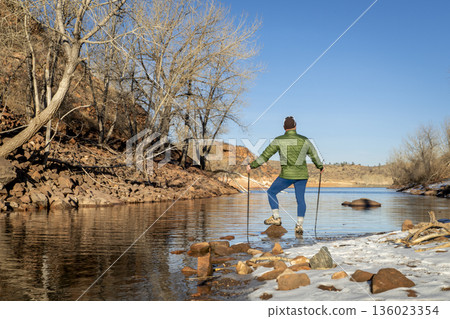 senior male hiker with trekking poles on a trail in Lory State Park in Colorado foothills 136023354