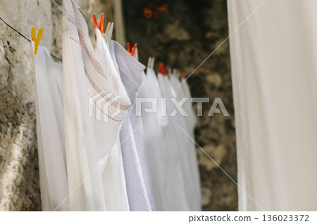 Freshly washed laundry hanging on the street in Dubrovnik old town, Croatia. Freshly washed laundry hanging on the street in Dubrovnik old town, Croatia. 136023372