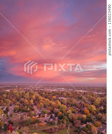 dawn over city of Fort Collins at foothills of Rocky Mountains in northern Colorado, aerial fall scenery dawn over city of Fort Collins at foothills of Rocky Mountains in northern Colorado, aerial fall scenery 136023490