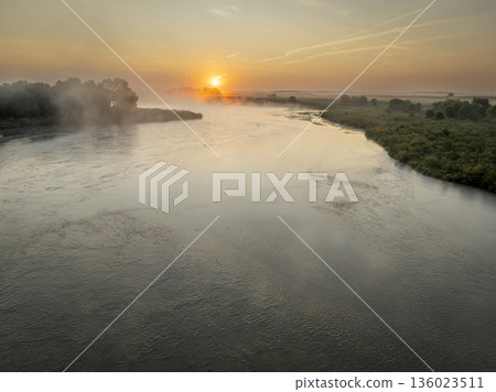 foggy sunrise over the Dismal River in Nebraska Sandhills at Nebraska National Forest, late summer morning scenery foggy sunrise over the Dismal River in Nebraska Sandhills at Nebraska National Forest, late summer morning scenery 136023511