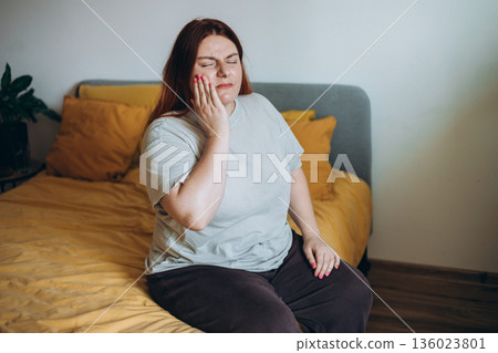 Frustrated woman with tooth ache for dental issue, jaw infection or gum disease at home. Female person, decay or sore teeth in discomfort for mouth cavity, illness or swollen abscess Frustrated woman with tooth ache for dental issue, jaw infection or gum disease at home. Female person, decay or sore teeth in discomfort for mouth cavity, illness or swollen abscess 136023801