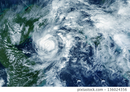 Hurricane from space. Atmospheric cyclone. Elements of this image furnished by NASA Hurricane from space. Atmospheric cyclone. Elements of this image furnished by NASA 136024356
