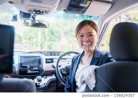 Smiling taxi driver woman 136024387