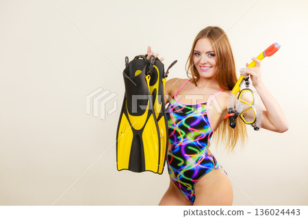 Woman with flippers and snorkeling mask having fun Woman with flippers and snorkeling mask having fun 136024443