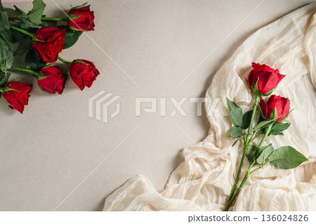 Mother's Day or Valentine's Day background. Red rose flowers on neutral background. Greeting card template, copy space Mother's Day or Valentine's Day background. Red rose flowers on neutral background. Greeting card template, copy space 136024826