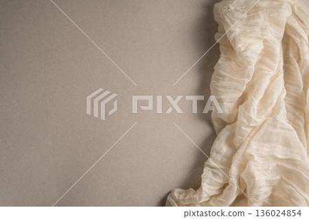 Ivory neutral cloth organic textile fabric template top view, copy space 136024854