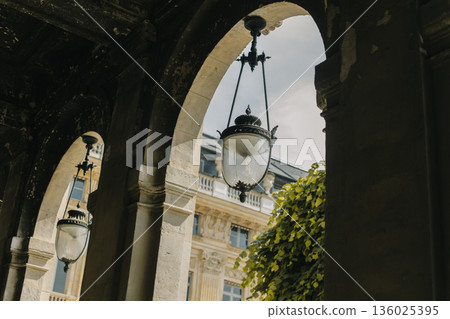 Beautiful lanterns with decor on the street of the old town of Paris, France. Beautiful lanterns with decor on the street of the old town of Paris, France. 136025395