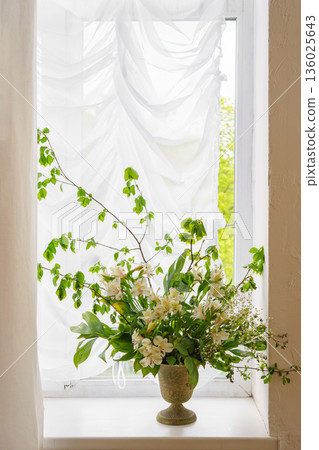 White alstroemeria, peruvian lily flower in vintage vase on window with white curtain background 136025643
