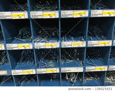 Nails of various sizes displayed in a store 136025831