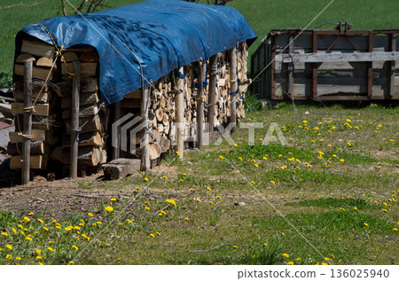 Firewood stacked in preparation for next winter 136025940