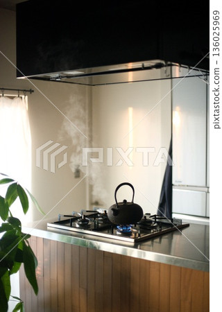 Boiling water in an iron kettle 136025969