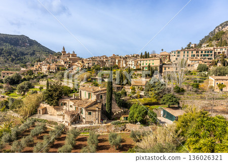 Panoramic view of the mountain village of Valldemossa with church Sant Bartomeu in Serra de Tramuntana mountains, Mallorca, Balearic Islands, Spain Panoramic view of the mountain village of Valldemossa with church Sant Bartomeu in Serra de Tramuntana mountains, Mallorca, Balearic Islands, Spain 136026321