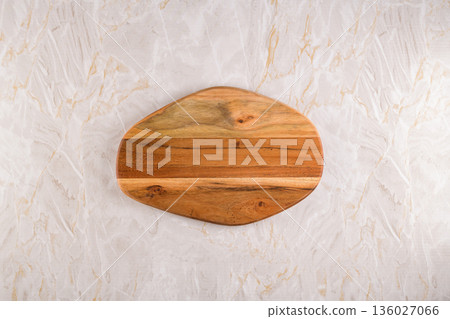 Wooden cutting board on a gray marble background 136027066