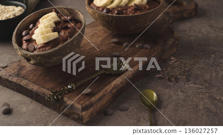 Coconut bowls with oat porridge Coconut bowls with oat porridge 136027257