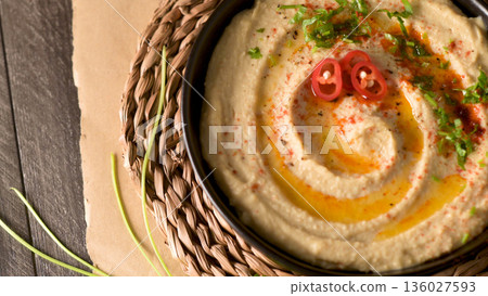Delicious hummus in ceramic bowl Delicious hummus in ceramic bowl 136027593