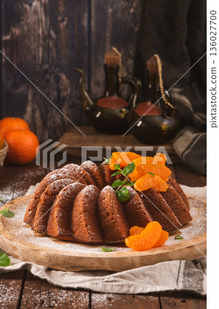 Mandarin Orange Bundt Cake with Powdered Sugar and Mint 136027700