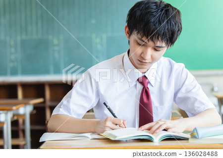 Male high school student studying Male high school student studying 136028488