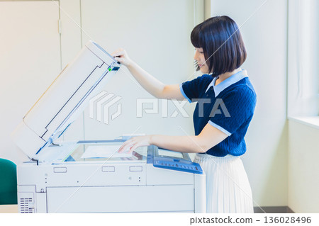 Woman working in an office Woman working in an office 136028496