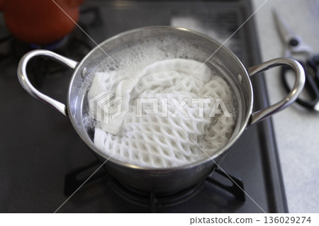Kitchen towels boiling in a pot Kitchen towels boiling in a pot 136029274