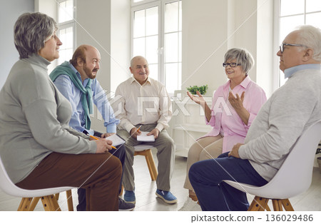 Several old people talking during a group therapy meeting at the retirement home Several old people talking during a group therapy meeting at the retirement home 136029486