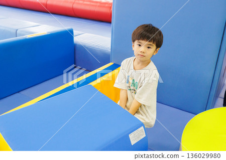 Boy playing with indoor playset Boy playing with indoor playset 136029980