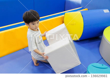 Boy playing with indoor playset Boy playing with indoor playset 136029981