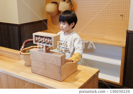 Boy playing with indoor playset Boy playing with indoor playset 136030220