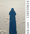 A shadow of a person on the beach 136030614
