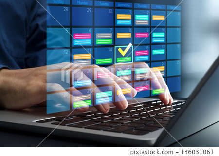 Scheduling and calendar management. Planning business appointments and tasks. Calendar on laptop. 136031061